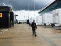 Tom Wilkinson strides around the F1 paddock.